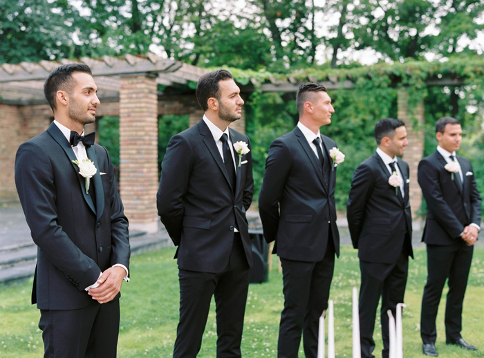 Groomsmen and groom outdoors wedding