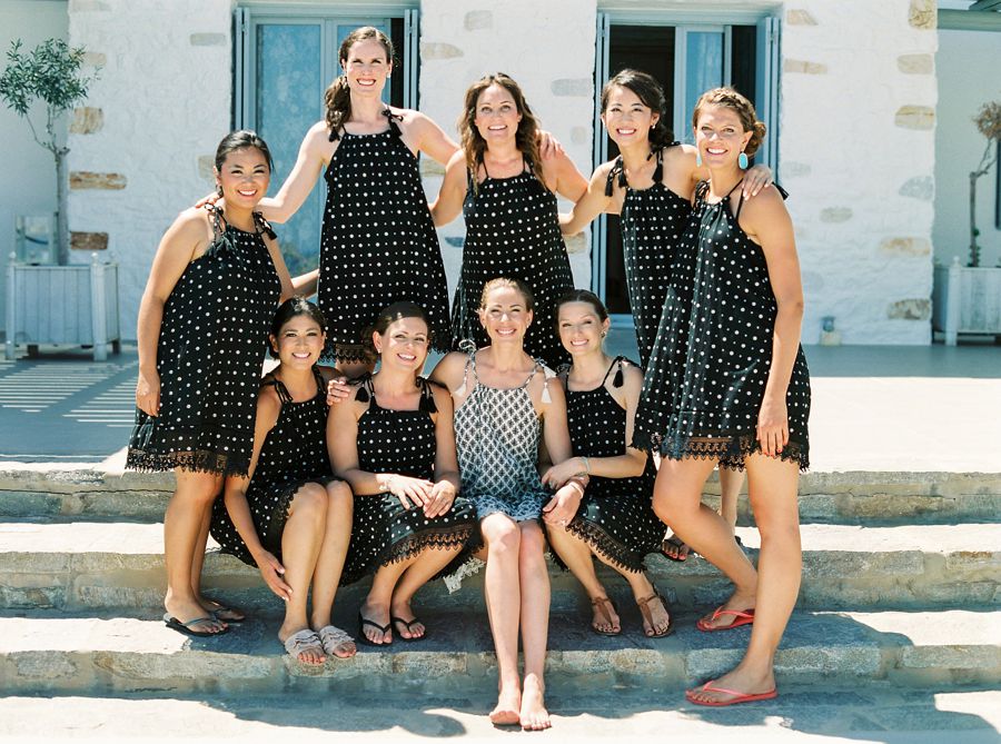 Bride with bridesmaids in matching black getting ready outfits