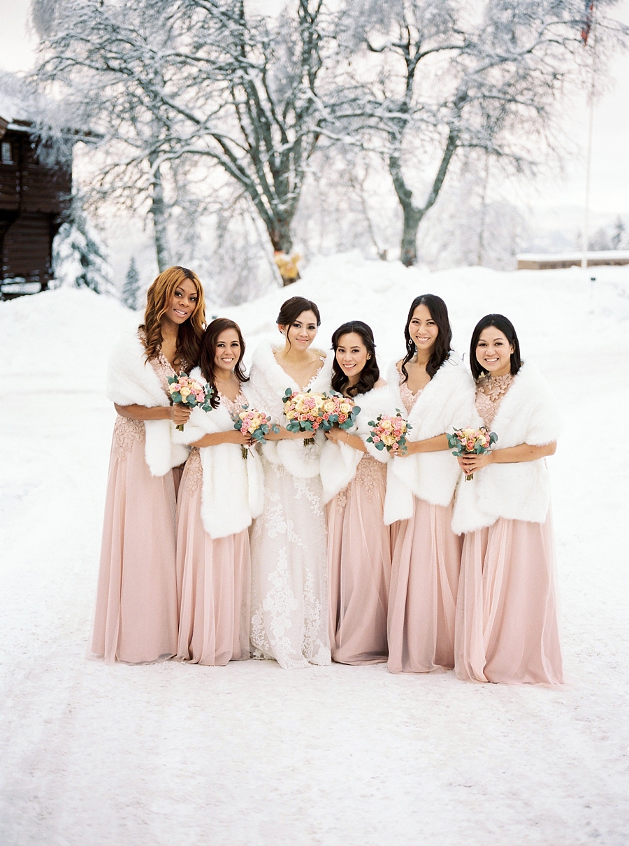 the bride with her bridesmaids in the snow