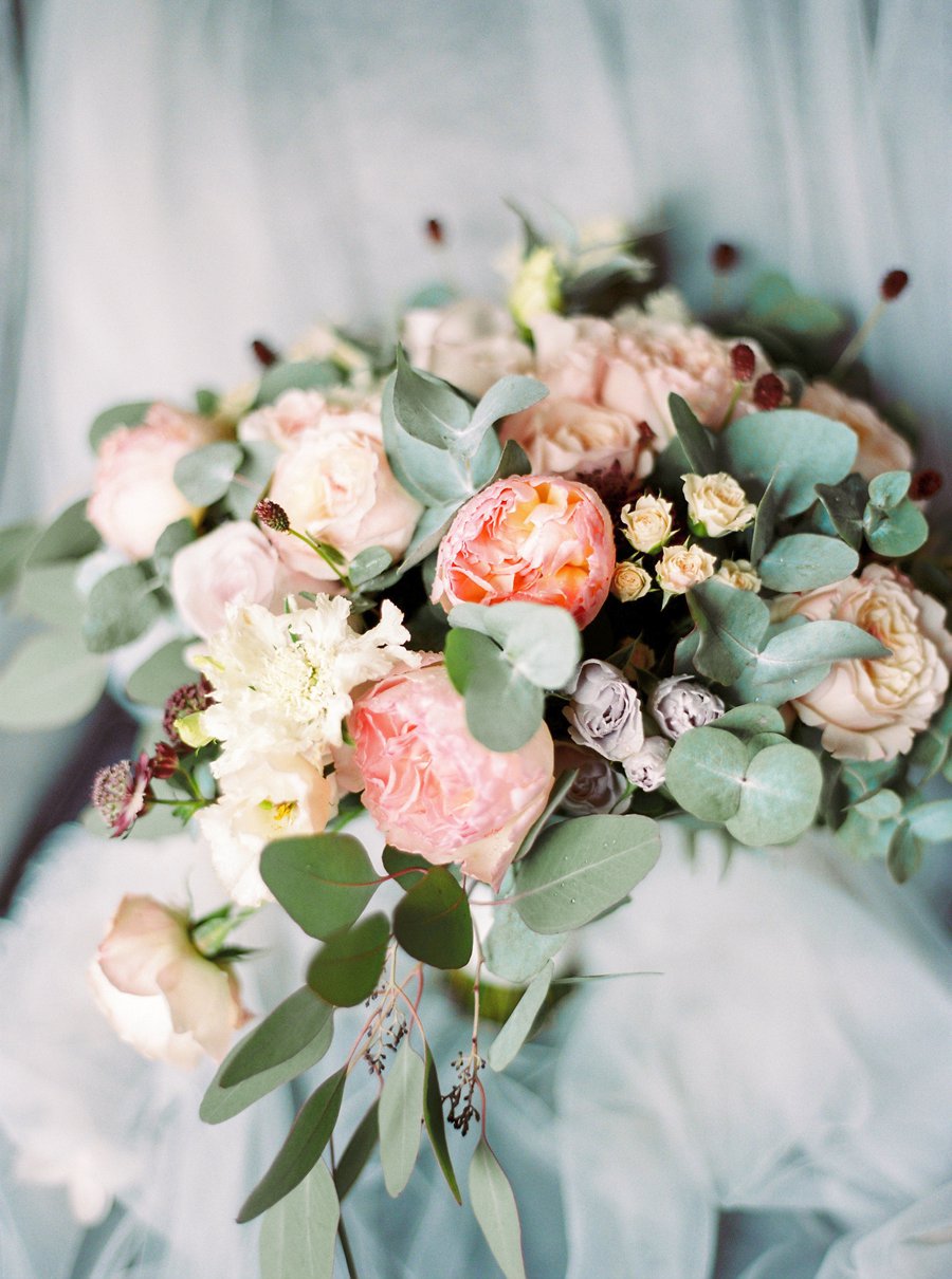 Organic bridal bouquet in blush garden roses and eucalyptus