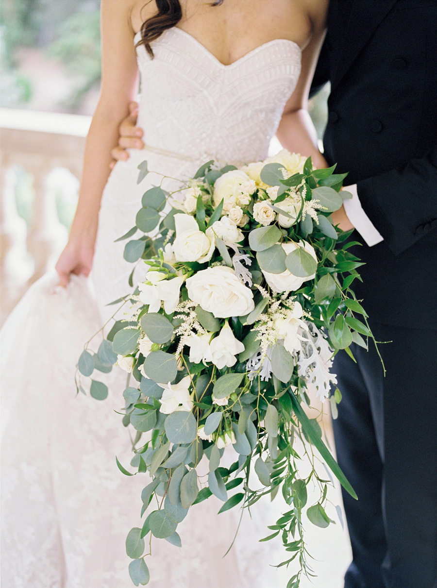 Cascading drop shaped wedding bouquet in white and green