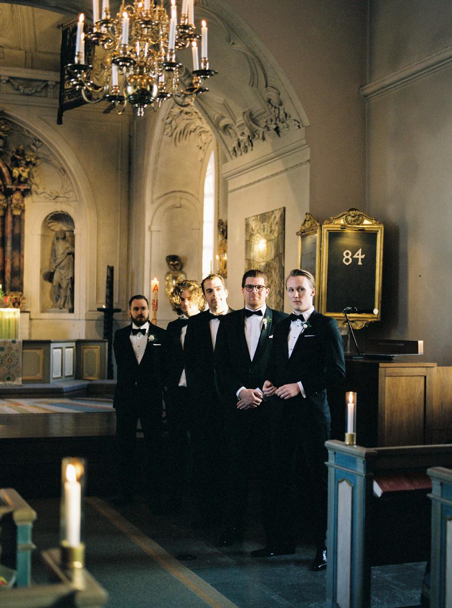 Groom with groomsmen waiting for the bride