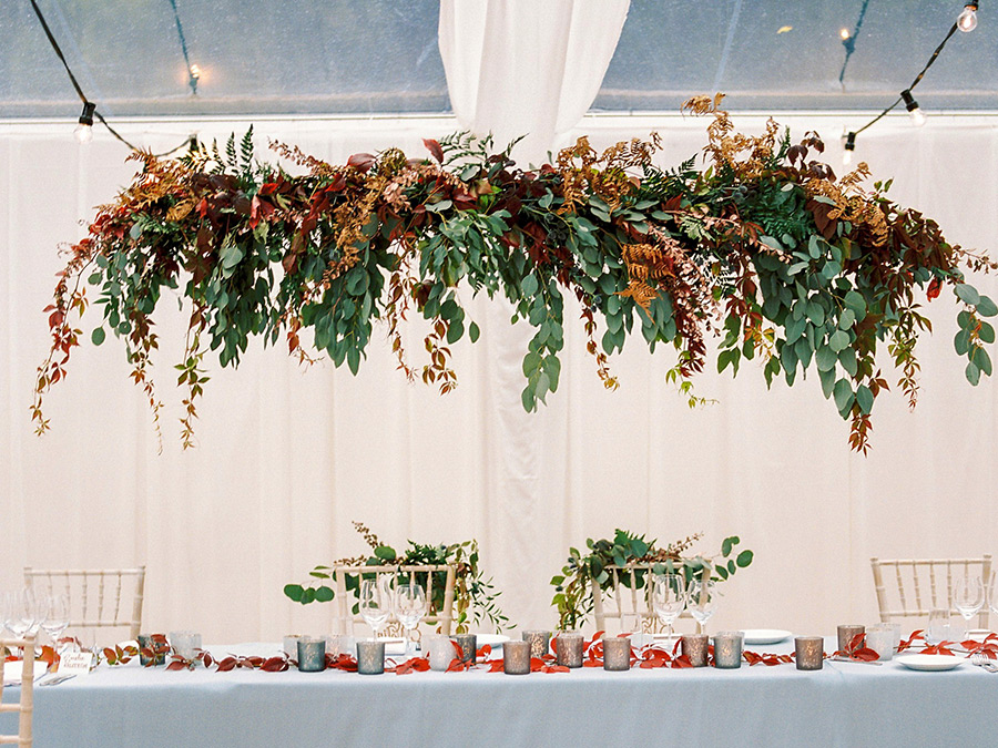 Hanging floral installation with autumn leaves