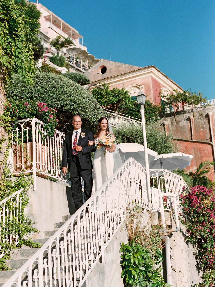 Father of the bride leading the bride to the wedding ceremony at Hotel Marincanto