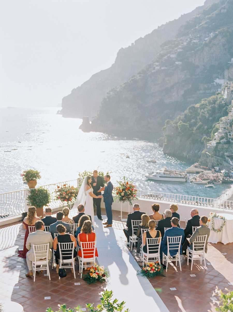 Amalfi destination wedding Hotel Marincanto. Wedding ceremony at the red terrace with view over Positano