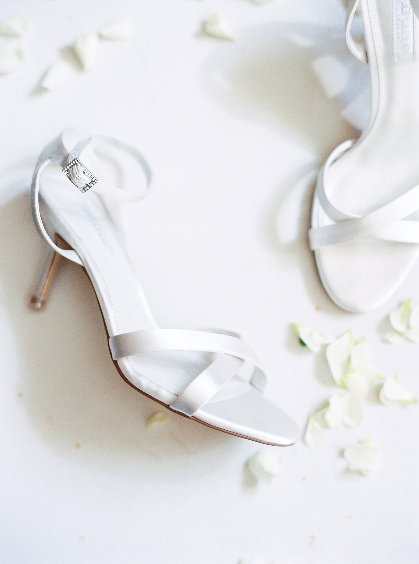 Detail of delicate high heel bridal shoes