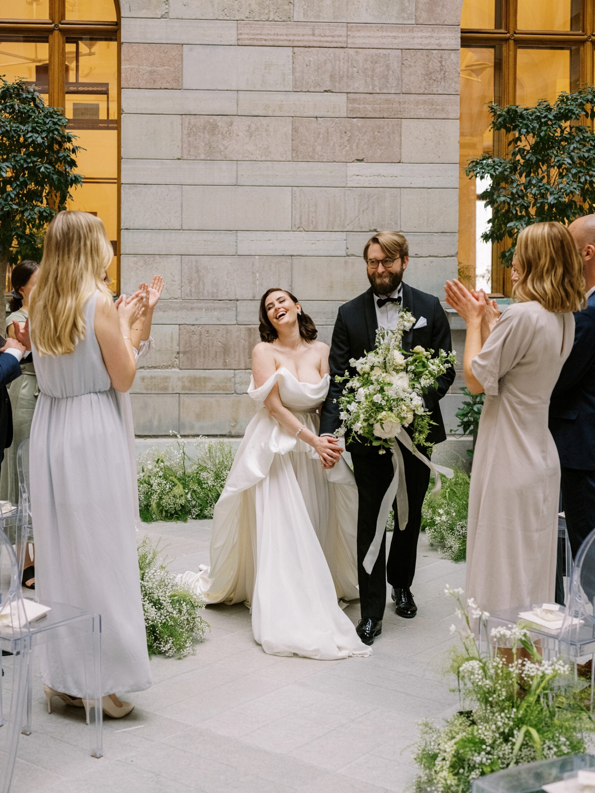 Bride and groom just married, at their wedding ceremony inside National Museum in Stockholm