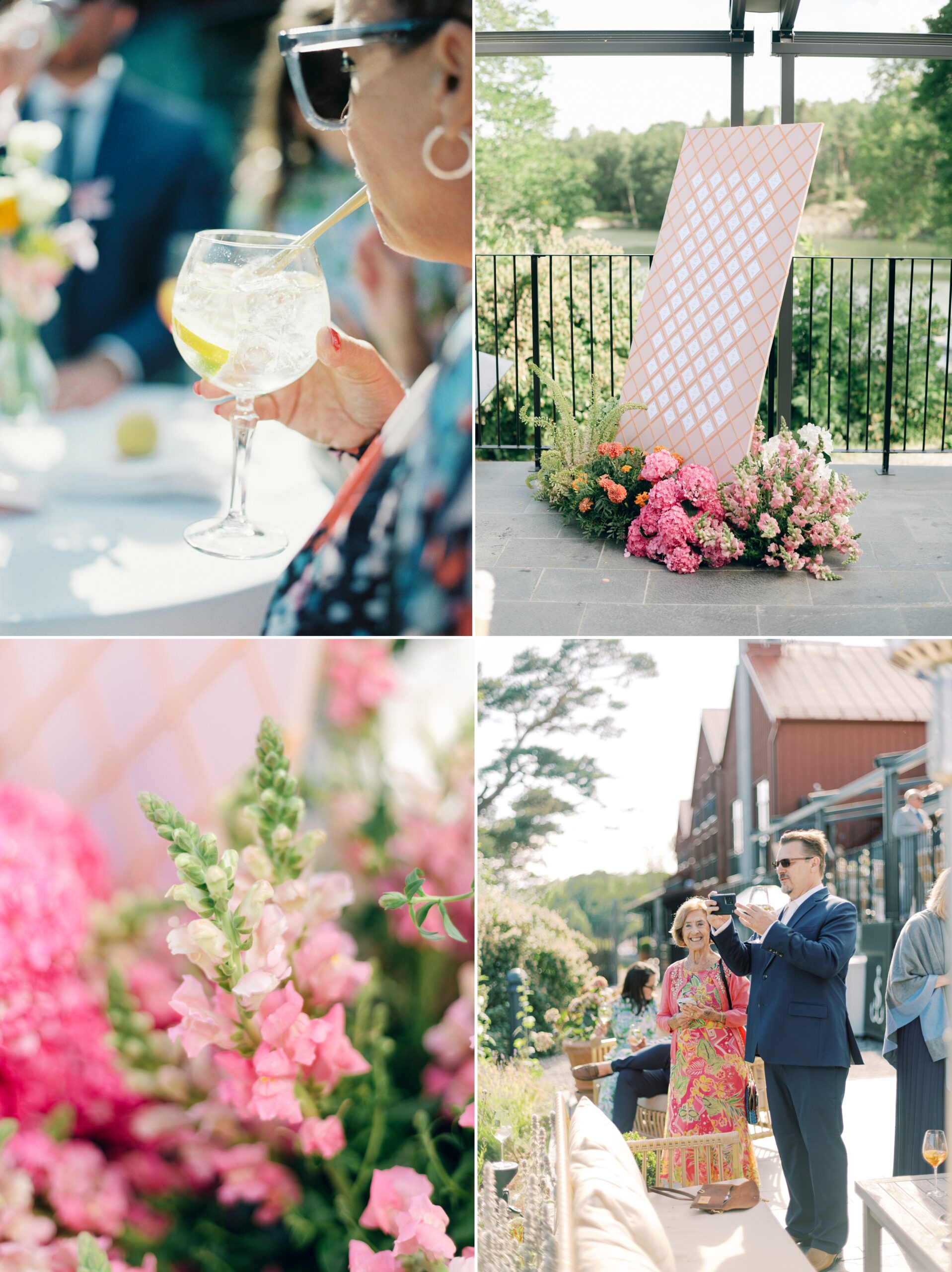 Graphic escort card display surrounded by bright blooms at a modern Swedish summer wedding
